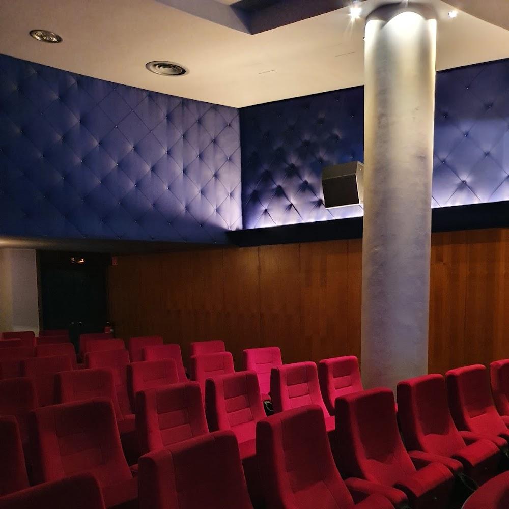 Red theatre seats in a theatre.
